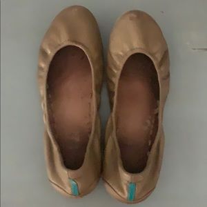 Very loved pair of gold tieks flats!